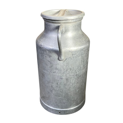 Metal milk churn on a white background