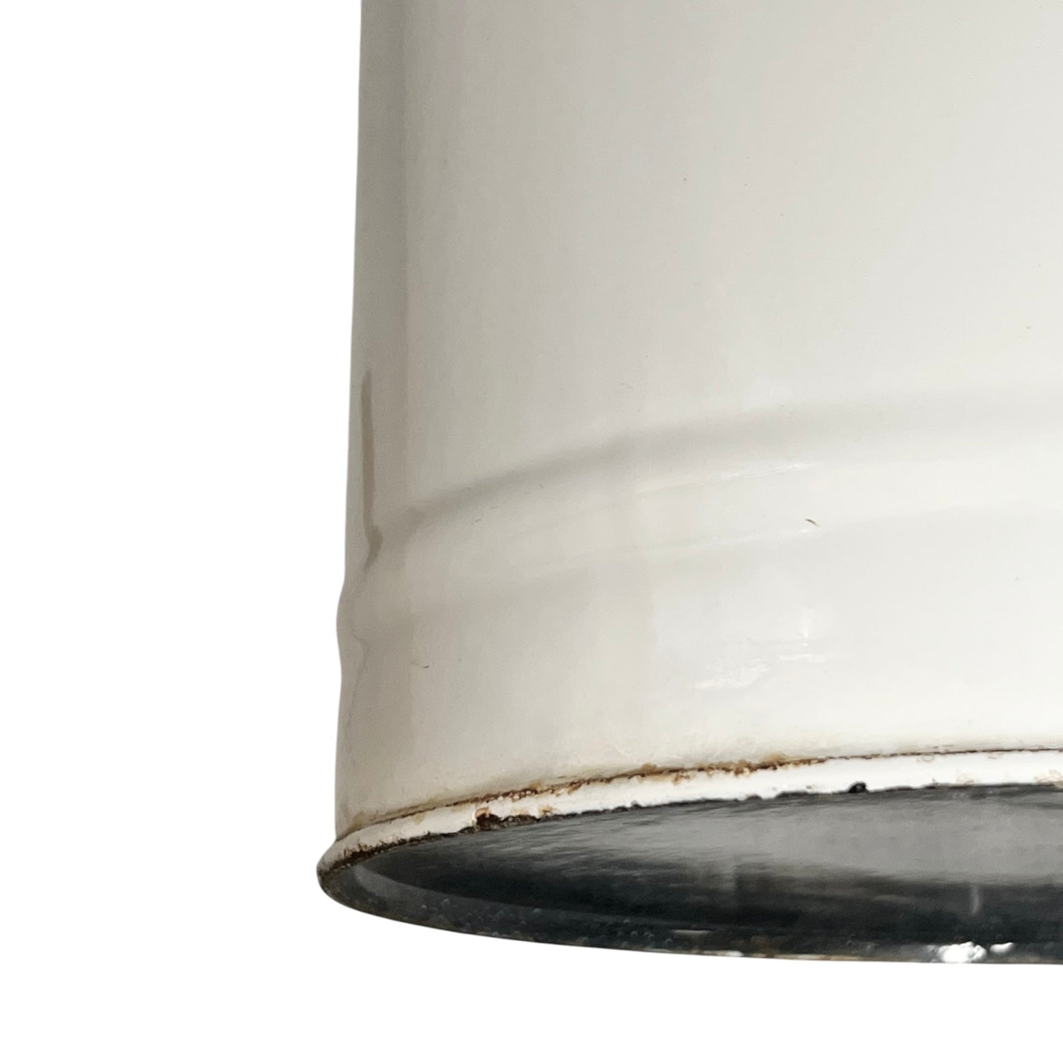 Close up of a vintage enamel lidded white bucket on a white background