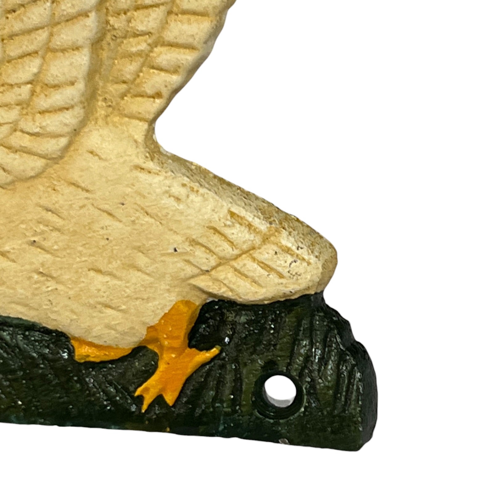 Close-up of a decorative goose head sculpture or wall piece with a textured beige upper body, dark green-black lower head and crest, and a small orange accent near the beak, shown on a white background.