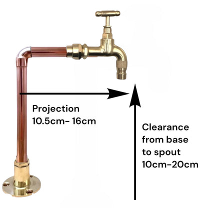 A brass deck-mounted faucet pipe assembly with a cross handle valve, shown on a white background with black measurement arrows and text indicating projection 10.5cm-16cm and clearance from base to spout 10cm-20cm.