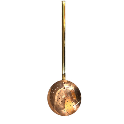 French vintage copper slotted spoon with a brass handle  on a white background