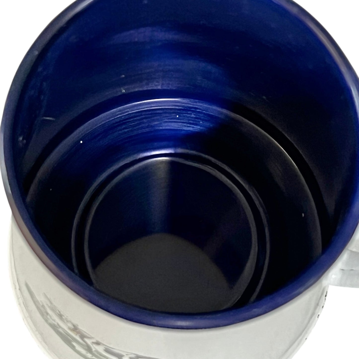 Close up of an enamel coffee pot on a white background
