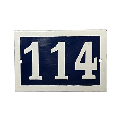 Navy blue rectangular sign with white numbers '114' on a white background