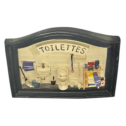 Close-up of a toilet door sign on a white background