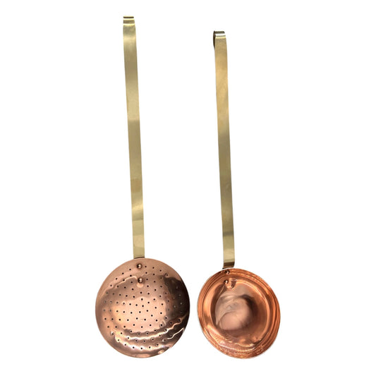 Set of 2 French copper utensils with long brass handles, includes a straining spoon and a ladle on a white background