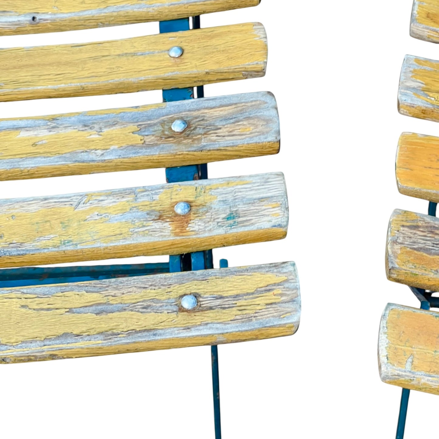 Close up of a wooden French folding chair on a white background 