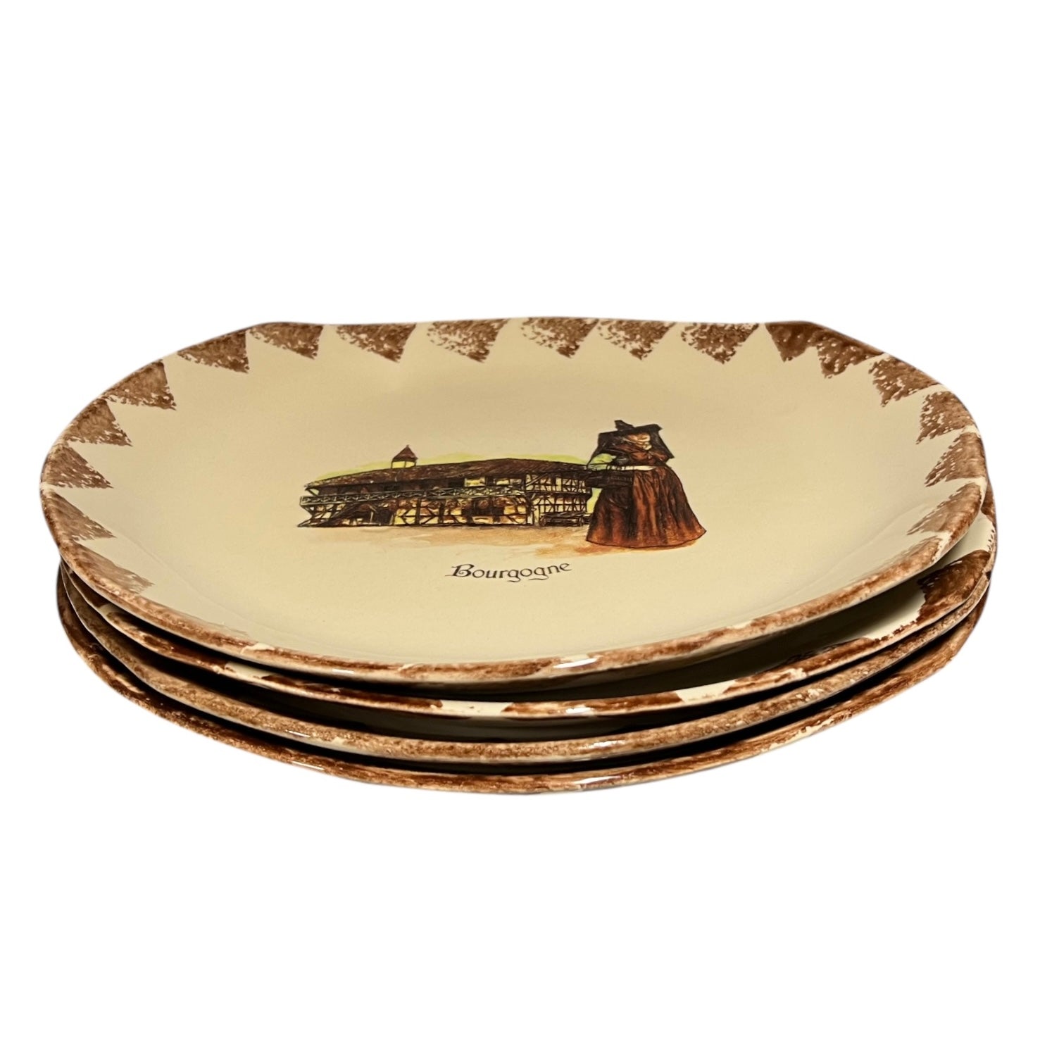Set of four decorative plates with a printed design on a beige background