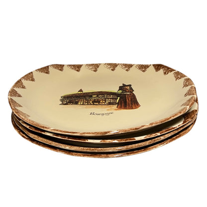 Set of four decorative plates with a printed design on a beige background