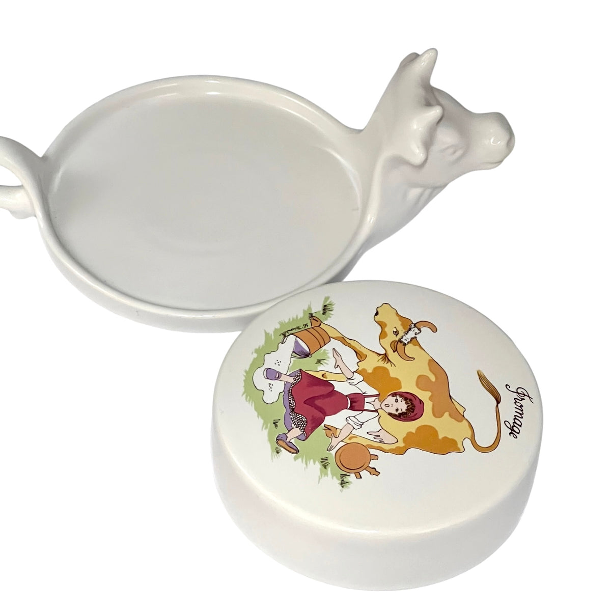 Vintage French L'Hirondelle porcelain cheese dish with cow-shaped white base and illustrated Fromage lid, traditional French farmhouse cheese server shown with lid detached 