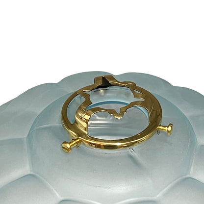 Angled view of the vintage French frosted pale blue glass pendant light shade with original brass gallery on a white background.