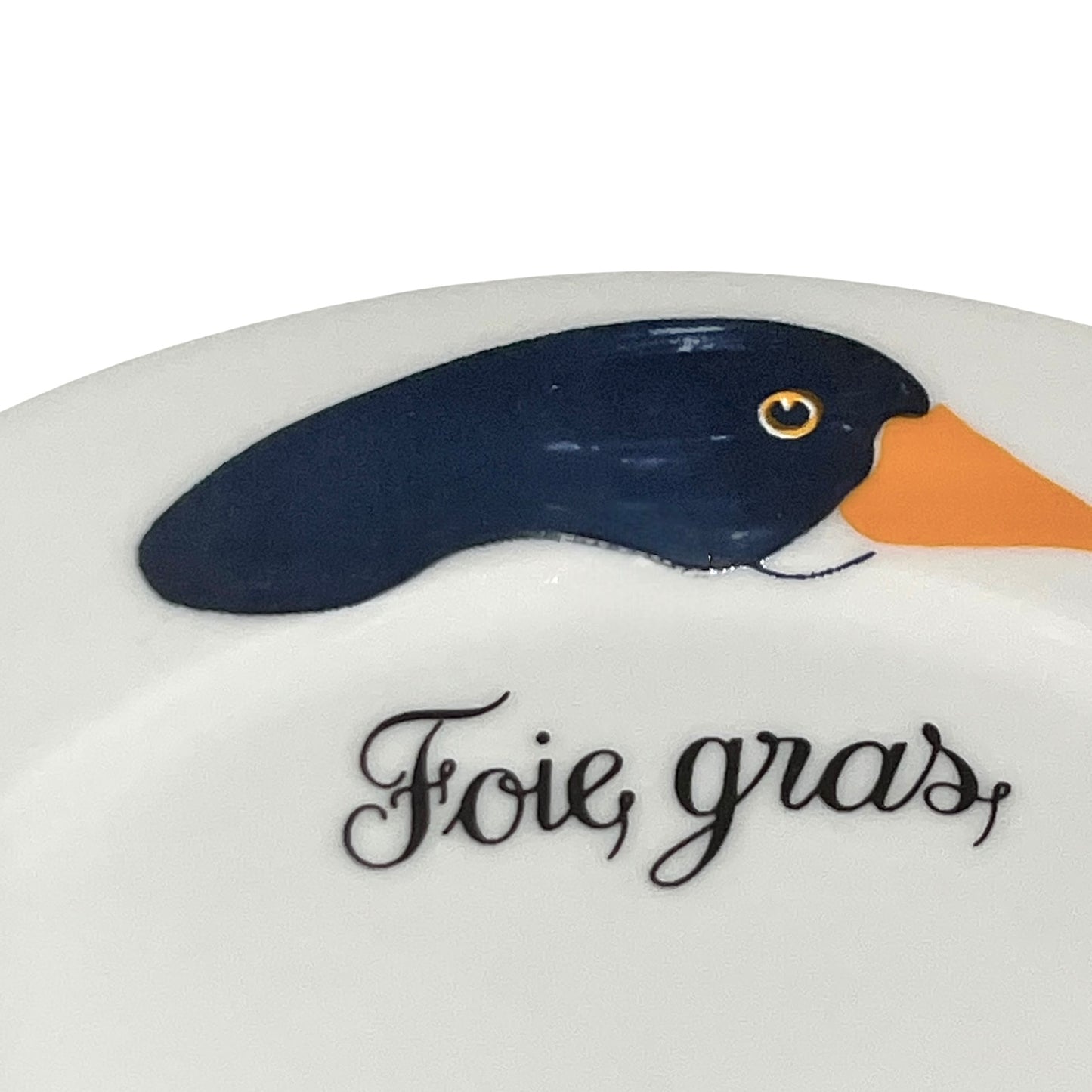 Decorative plate with a duck illustration and 'Foie gras' text on a white background