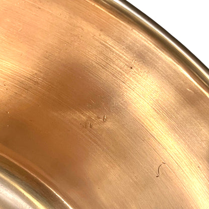 Small scratches on the edge of a copper sink 