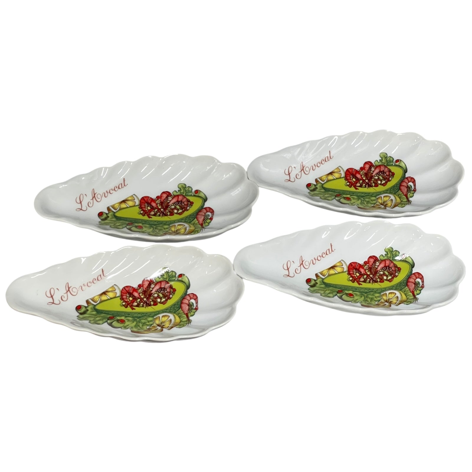 Set of shell-shaped porcelain avocado dishes  decorative designs and 'L'Avocat' branding on a white background.