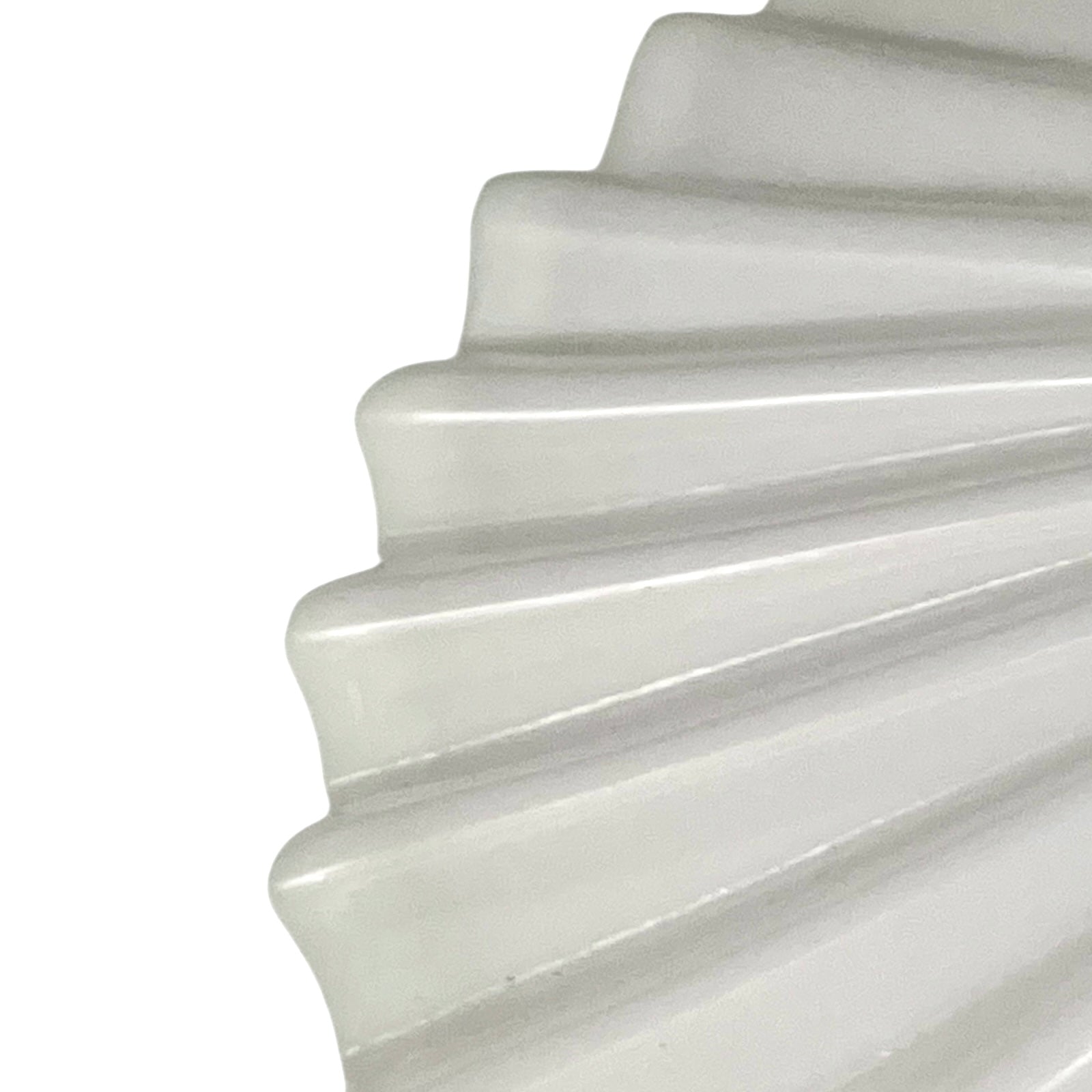 Close up of French glass lampshade on a white background