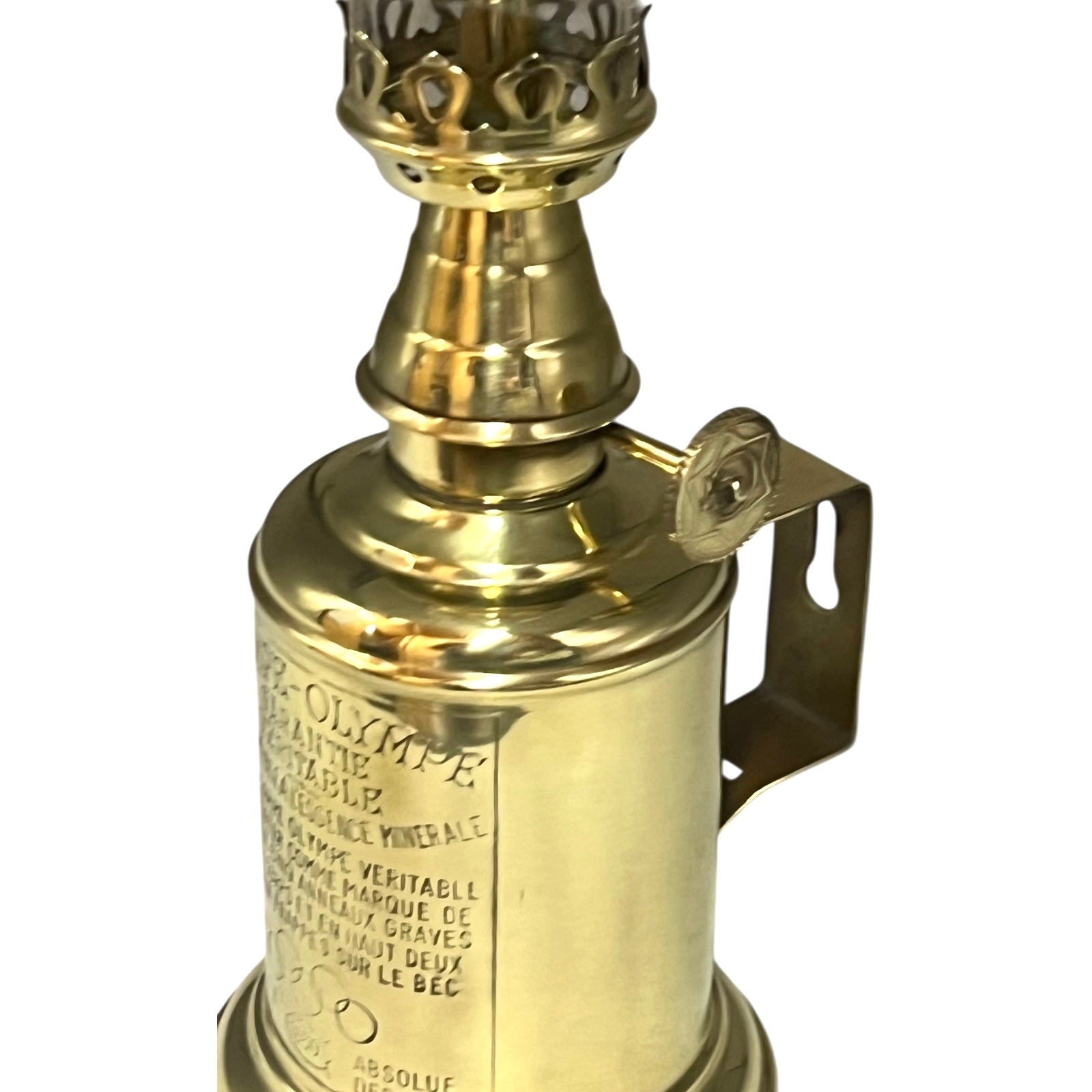Brass lamp with intricate design on a white background