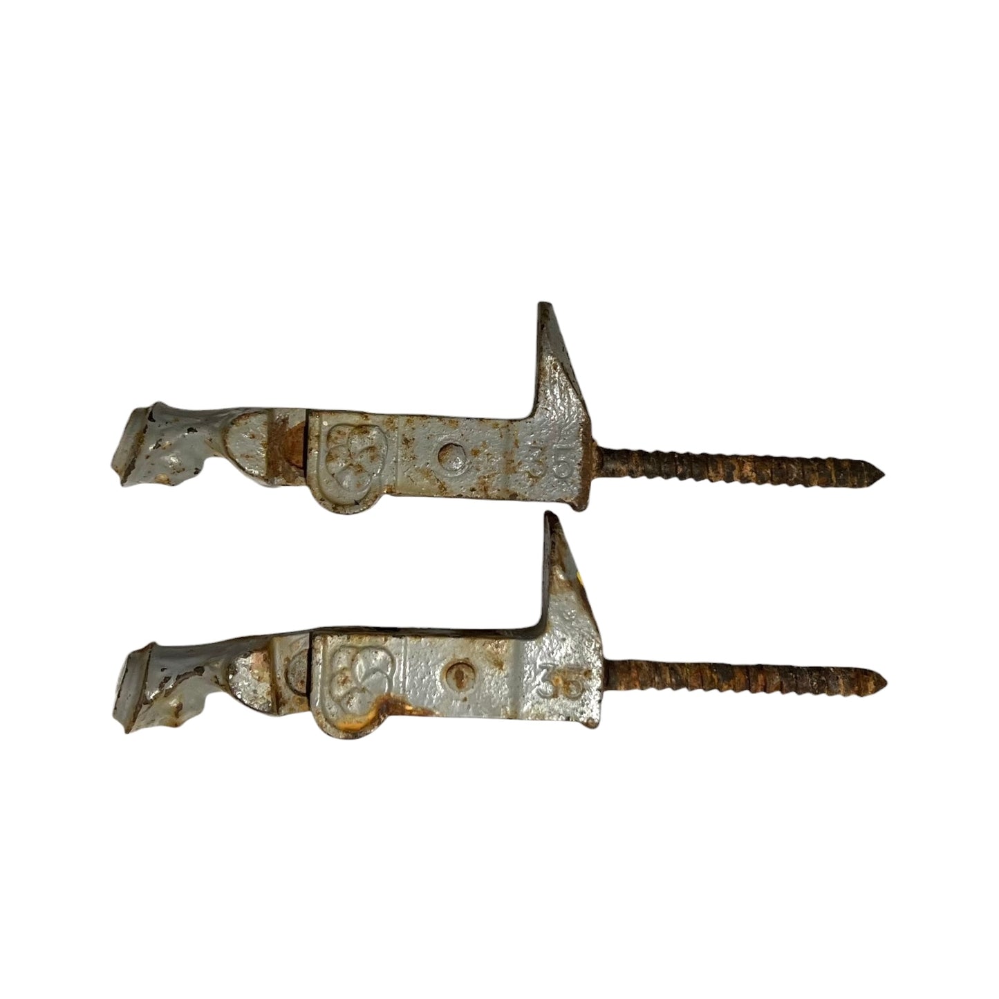 Two vintage metal shutter catches with rusted surfaces and threaded screw ends, shown on a plain white background.