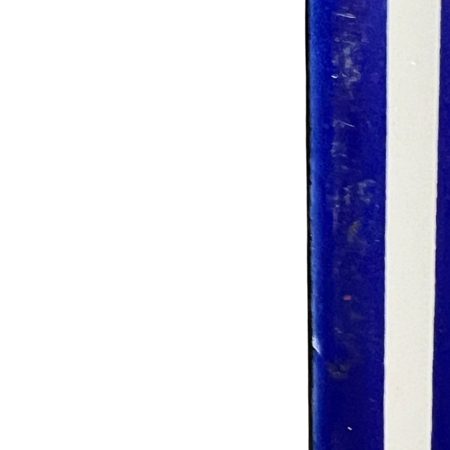 Close up of a blue door number sign 
