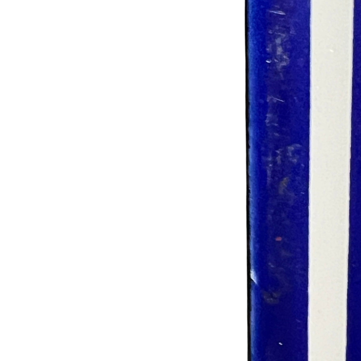 Close up of a blue door number sign 