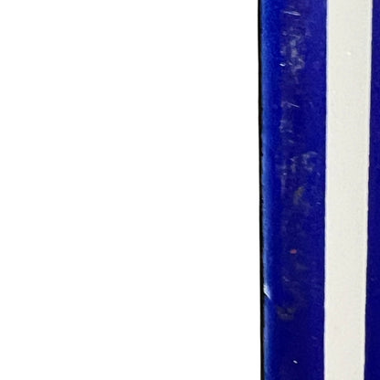 Close up of a blue door number sign 