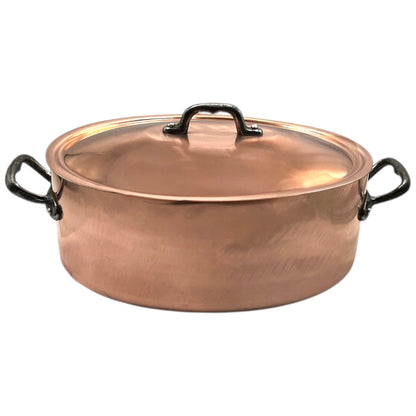 Copper pot with lid on a white background