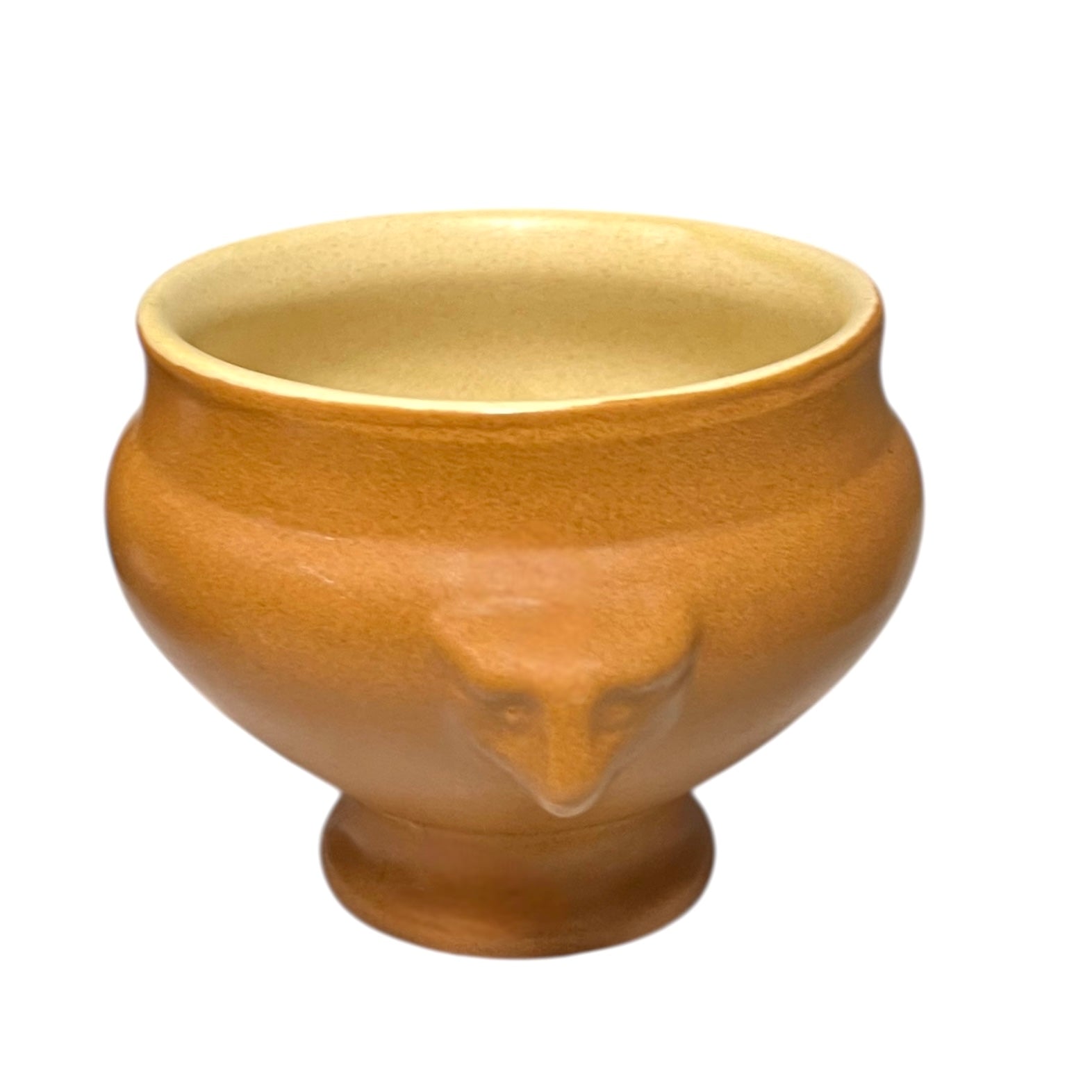 light brown ceramic French soup bowl with lions head handles on a white background 