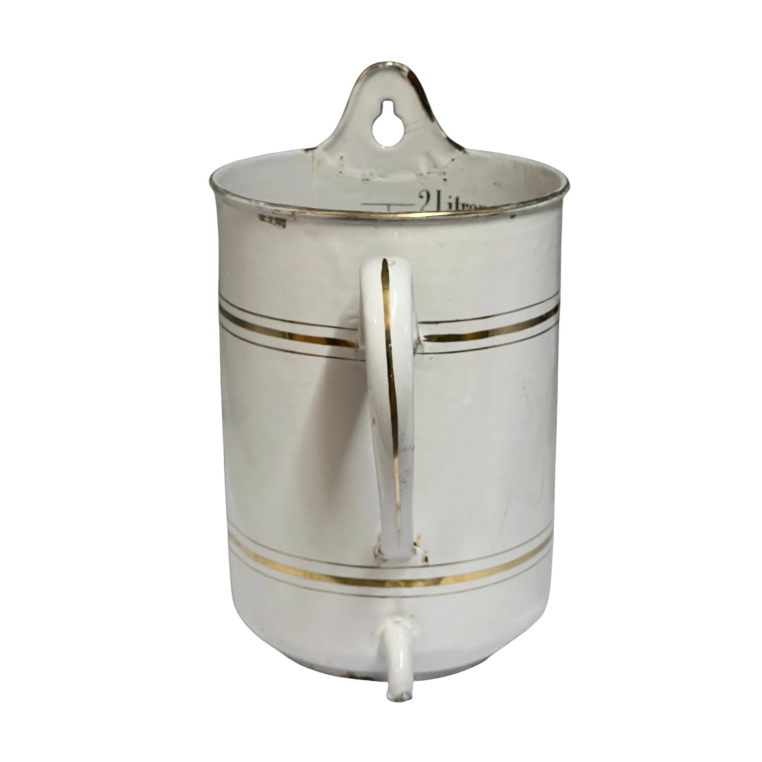 A vintage white enamel pot or planter with gold trim, featuring a lid with a carrying loop, a side handle, and a small spout, set against a plain white background.