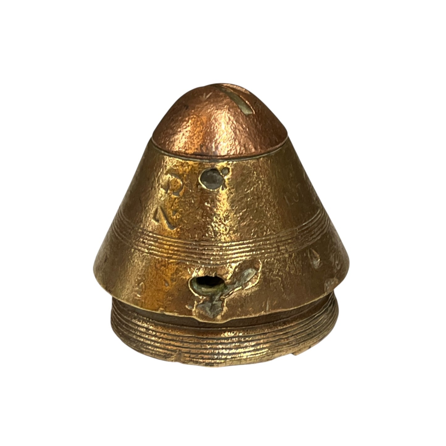 A small vintage metallic object with a conical, helmet-like shape in aged brass or bronze, featuring a textured surface, horizontal ridges, and a threaded base, isolated on a white background.