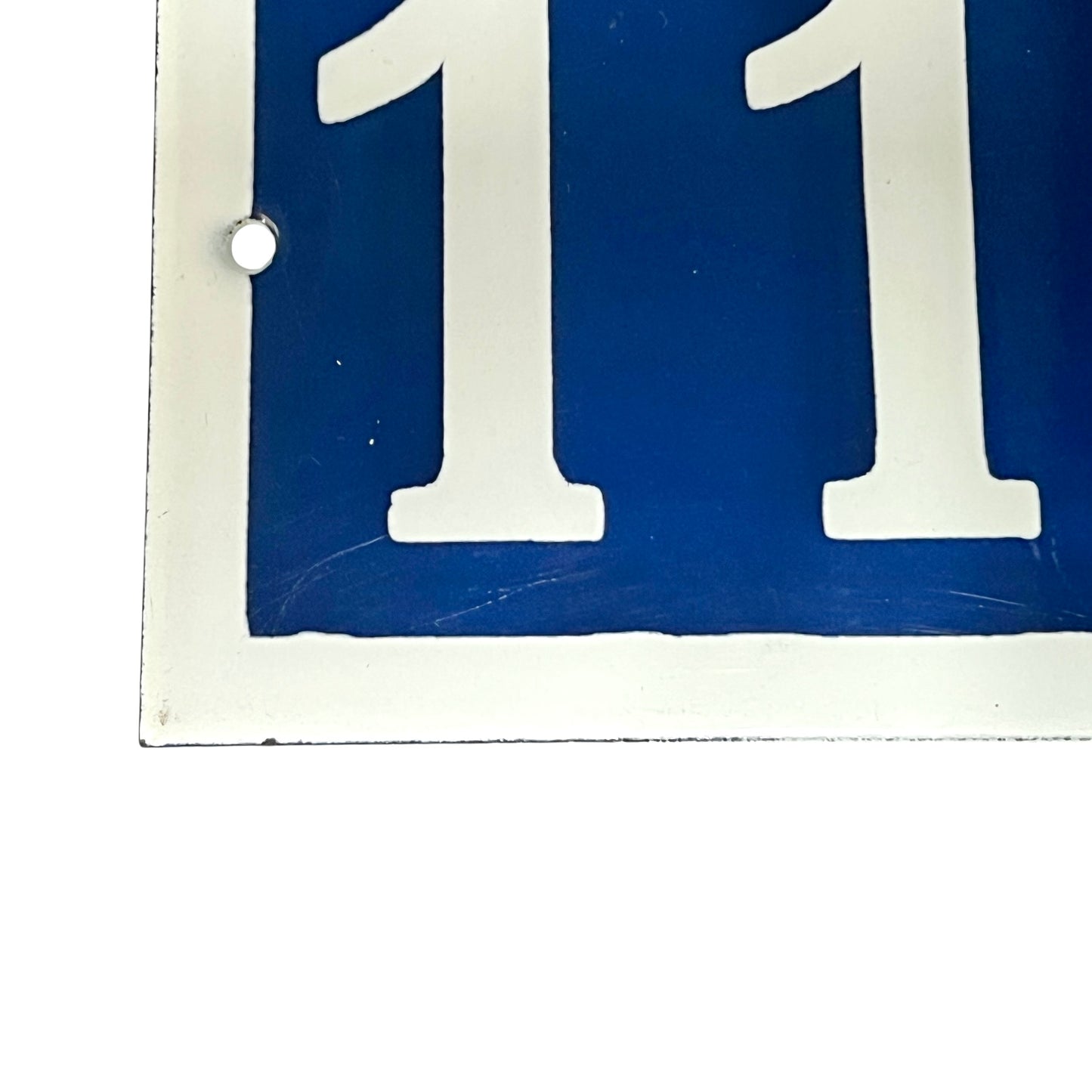 Close up of a French door number on a white background