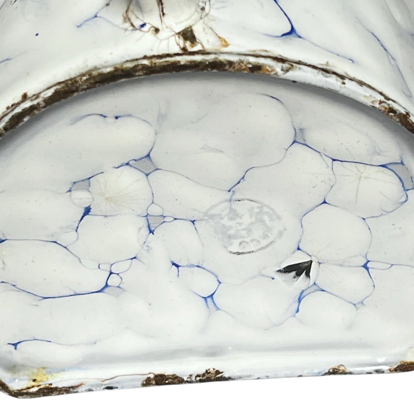 Close up of the base of a vintage French enamel irrigator