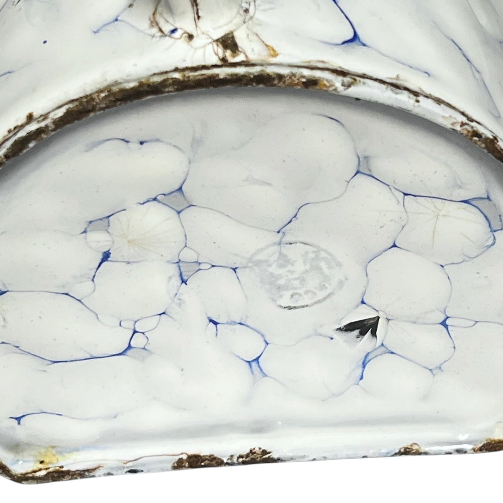 Close up of the base of a vintage French enamel irrigator