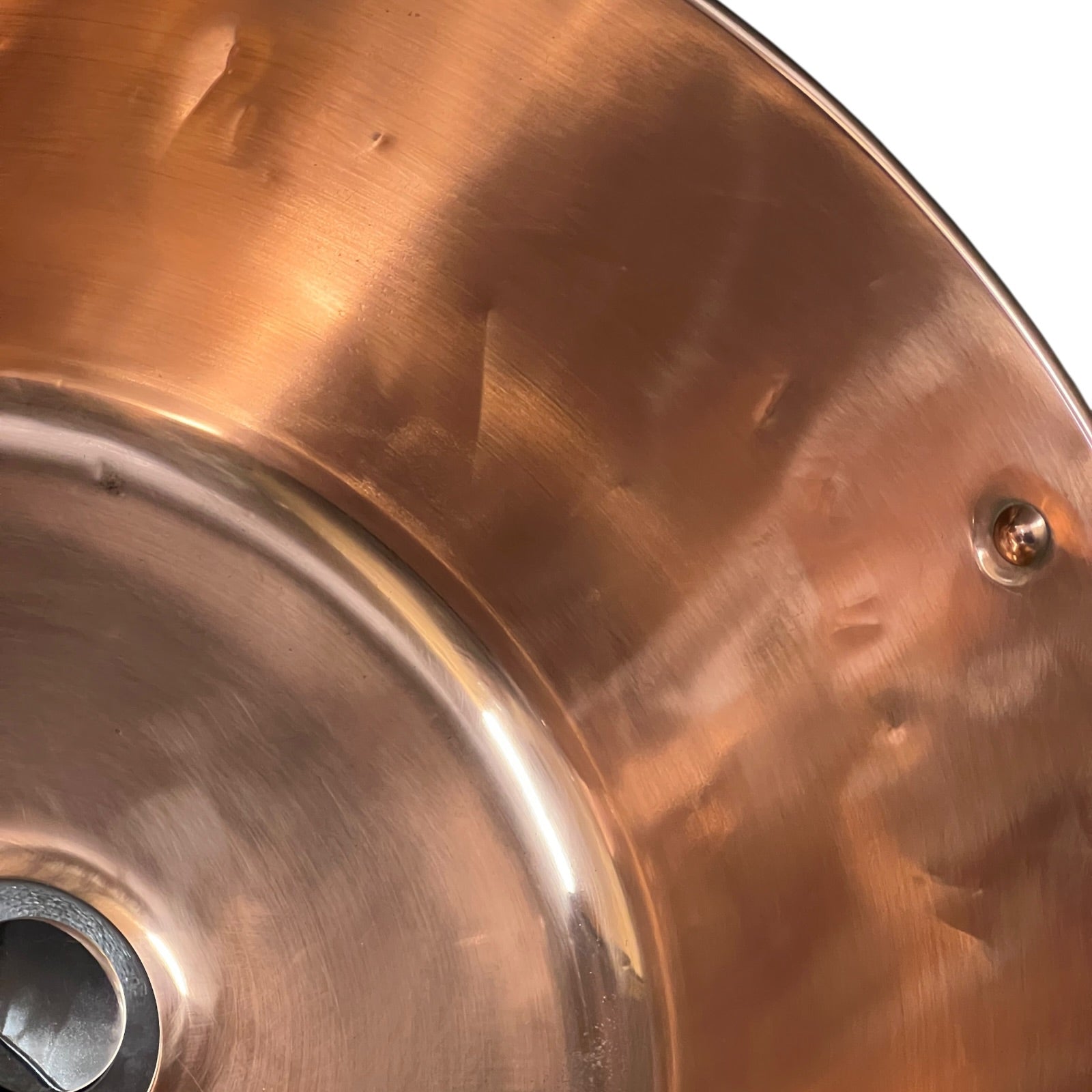 Close-up of a copper sink on a white background