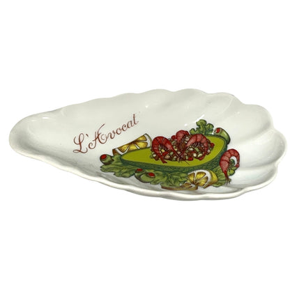 Decorative ceramic dish with 'L'Avocat' text and avocado design on a white background