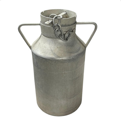 Metal milk churn with handles on a white background