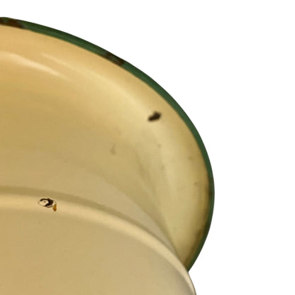 Close up of a French enamel bucket on a white background 