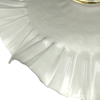 Close up of a French vintage frosted glass lampshade with a frilled scalloped style edge  on a white background