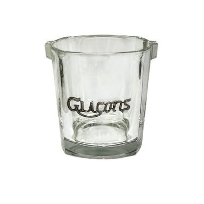 A clear glass ice bucket featuring the word Glacons' in a metal decoration on the front, set against a plain white background.