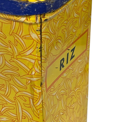 Close-up of a yellow container with 'Riz' branding on a white background