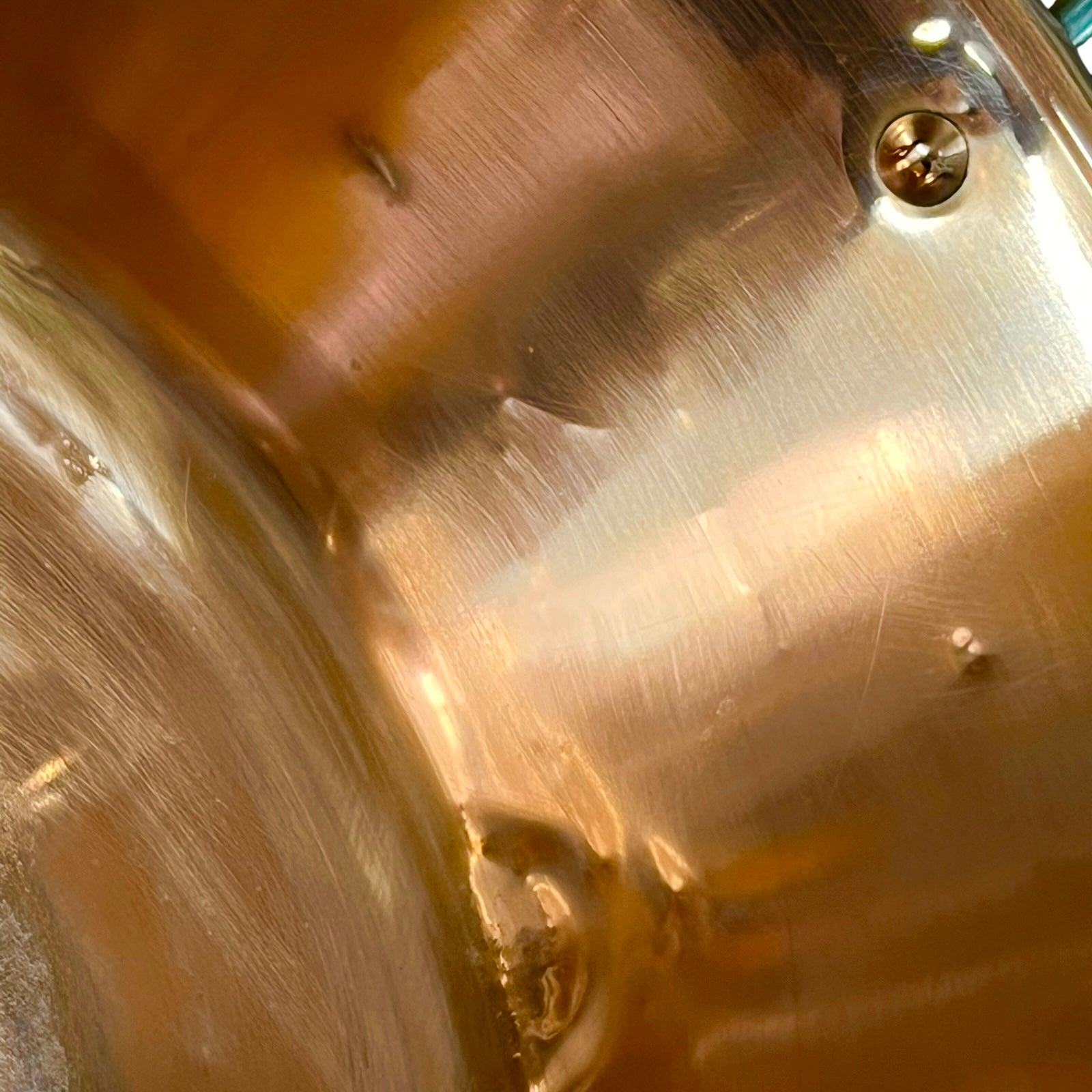 Close up of a French copper bathroom basin on a white background