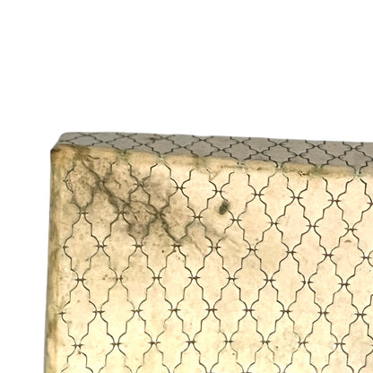 Beige box with a subtle pattern on a white background