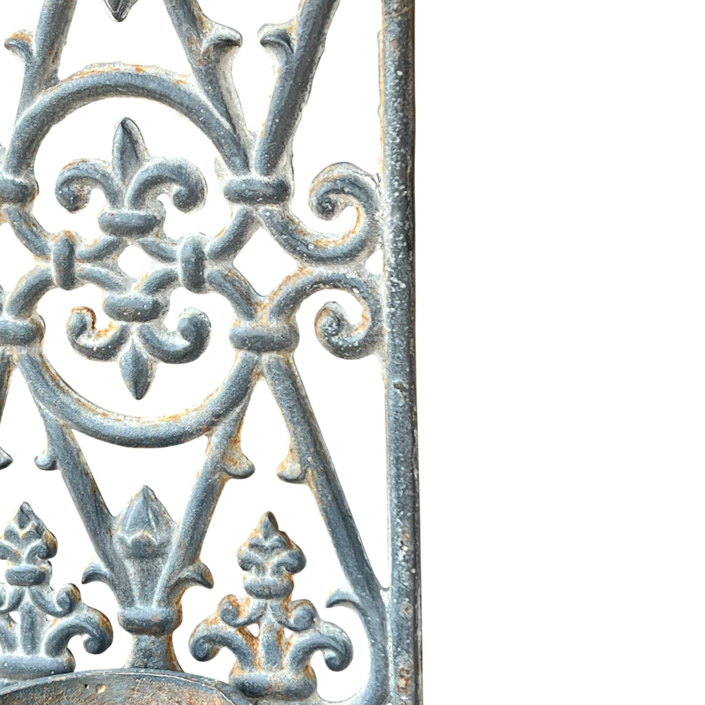 close up of a metal decorative wall planter on a white background