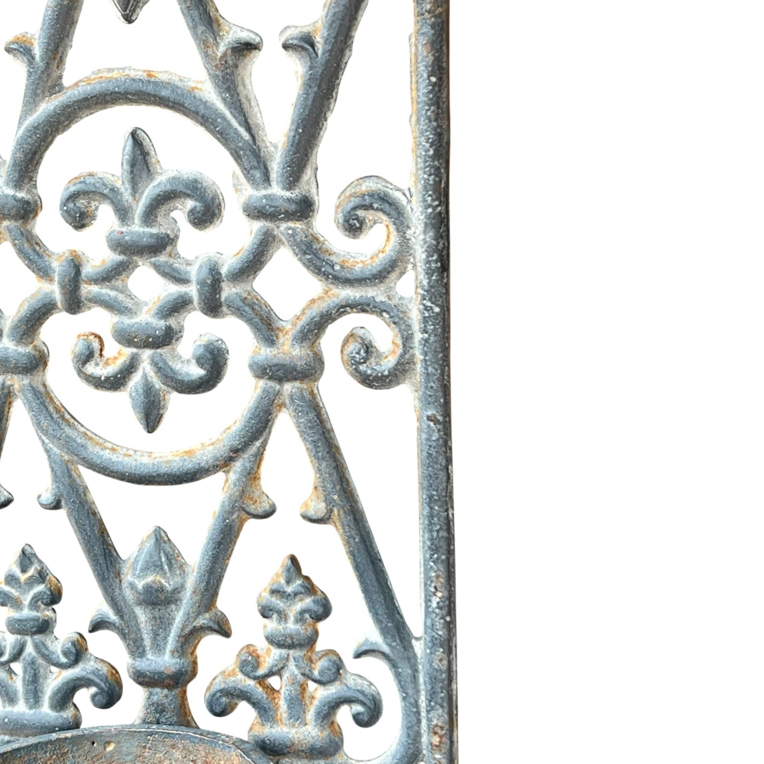 close up of a metal decorative wall planter on a white background