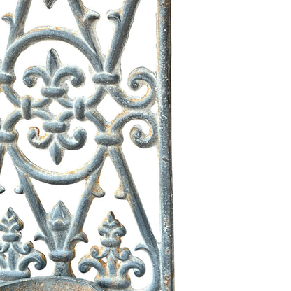 close up of a metal decorative wall planter on a white background