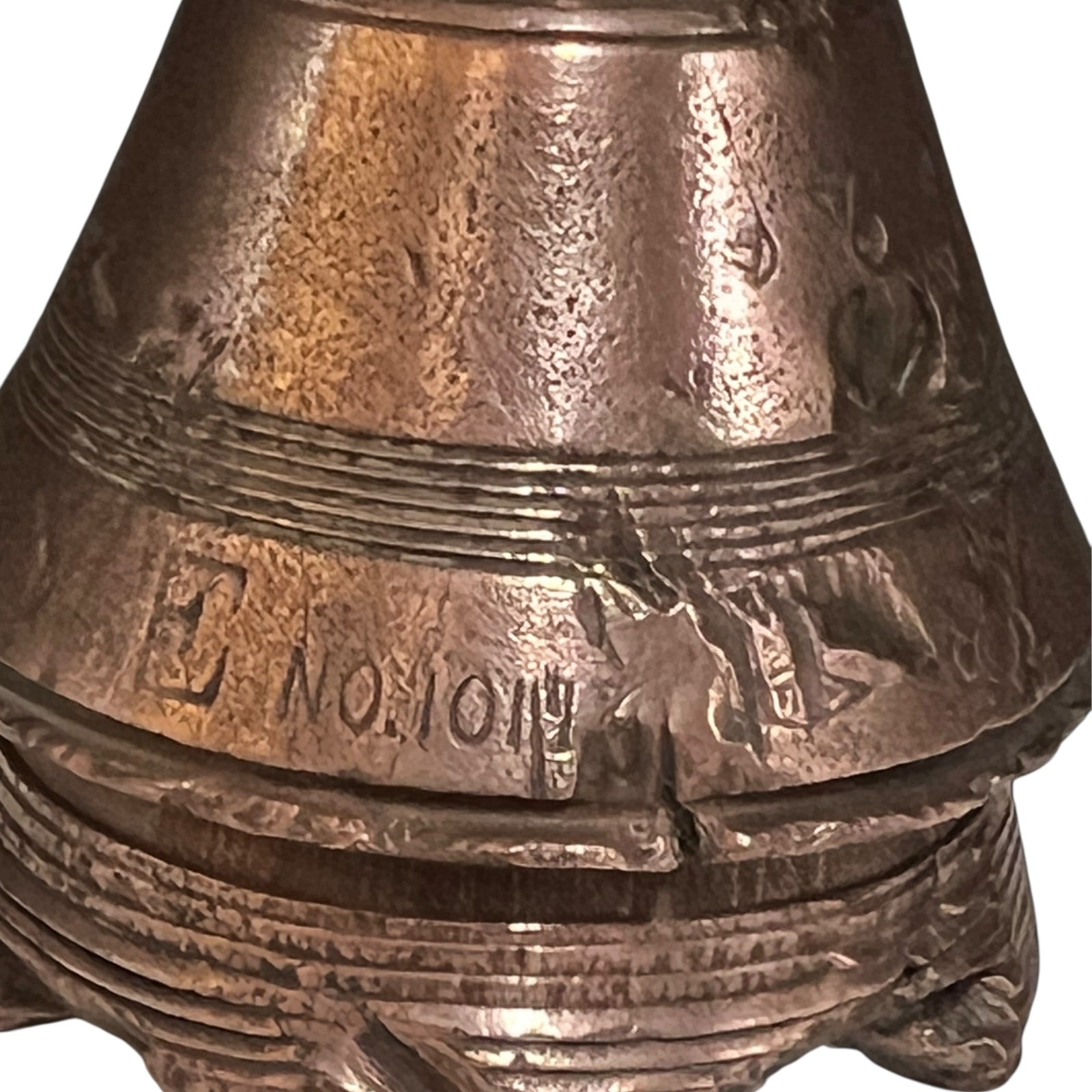 WW1 brass fuse paperweight on a white background 
