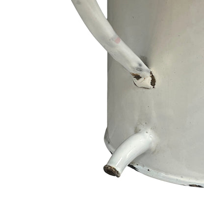 Close up of  French vintage enamel planter with a flat back and a spout on a white background