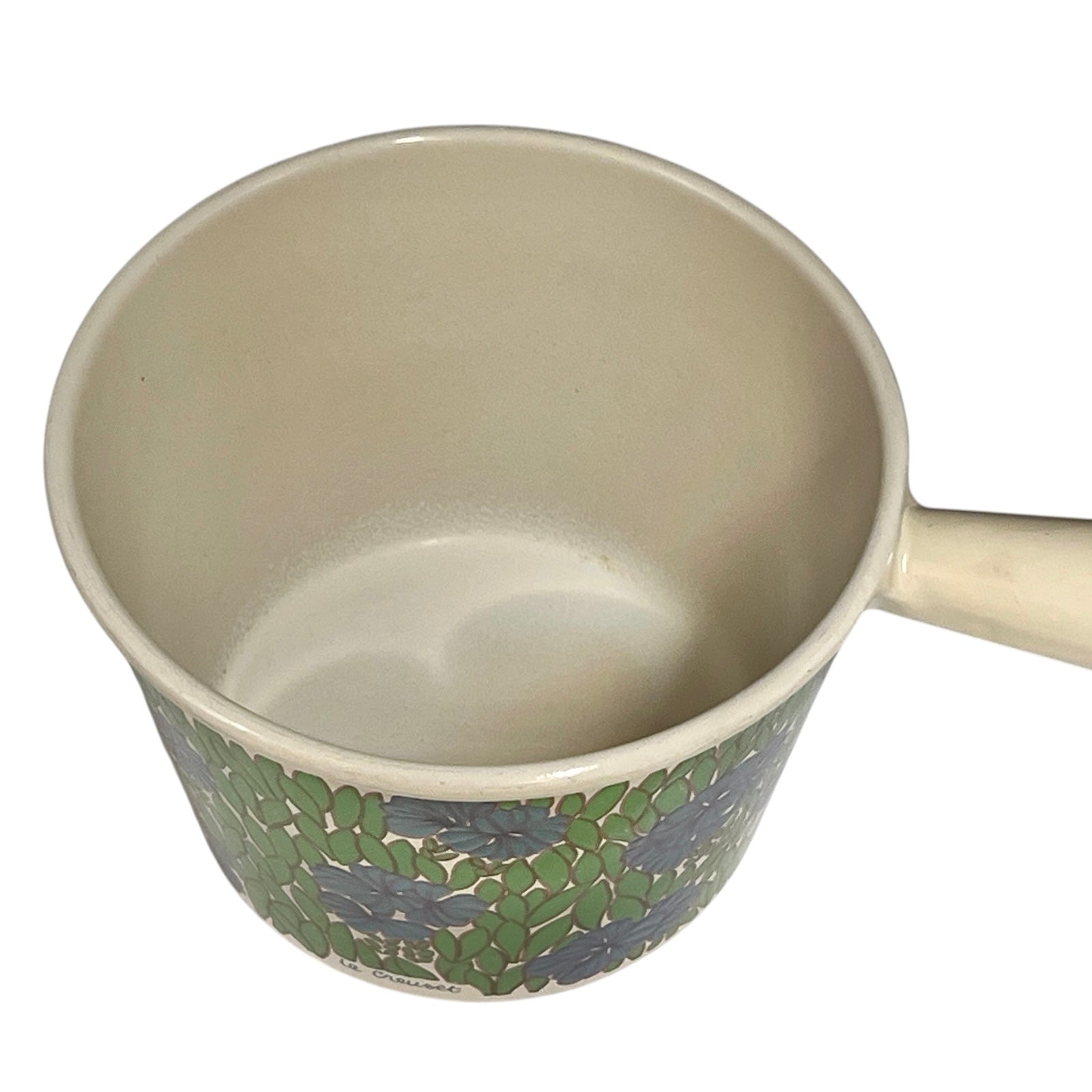 Inside view of a vintage Le Creuset saucepan on a white background 
