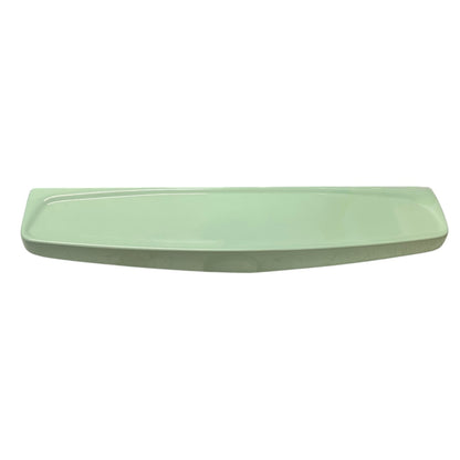 Pale green ceramic shelf on a white background