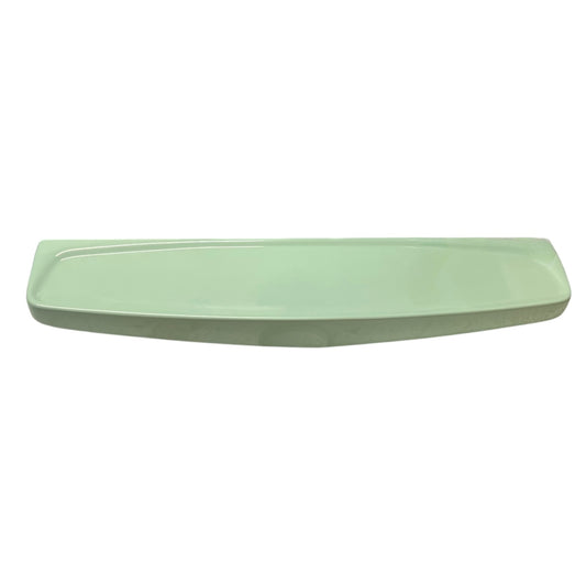 Pale green ceramic shelf on a white background