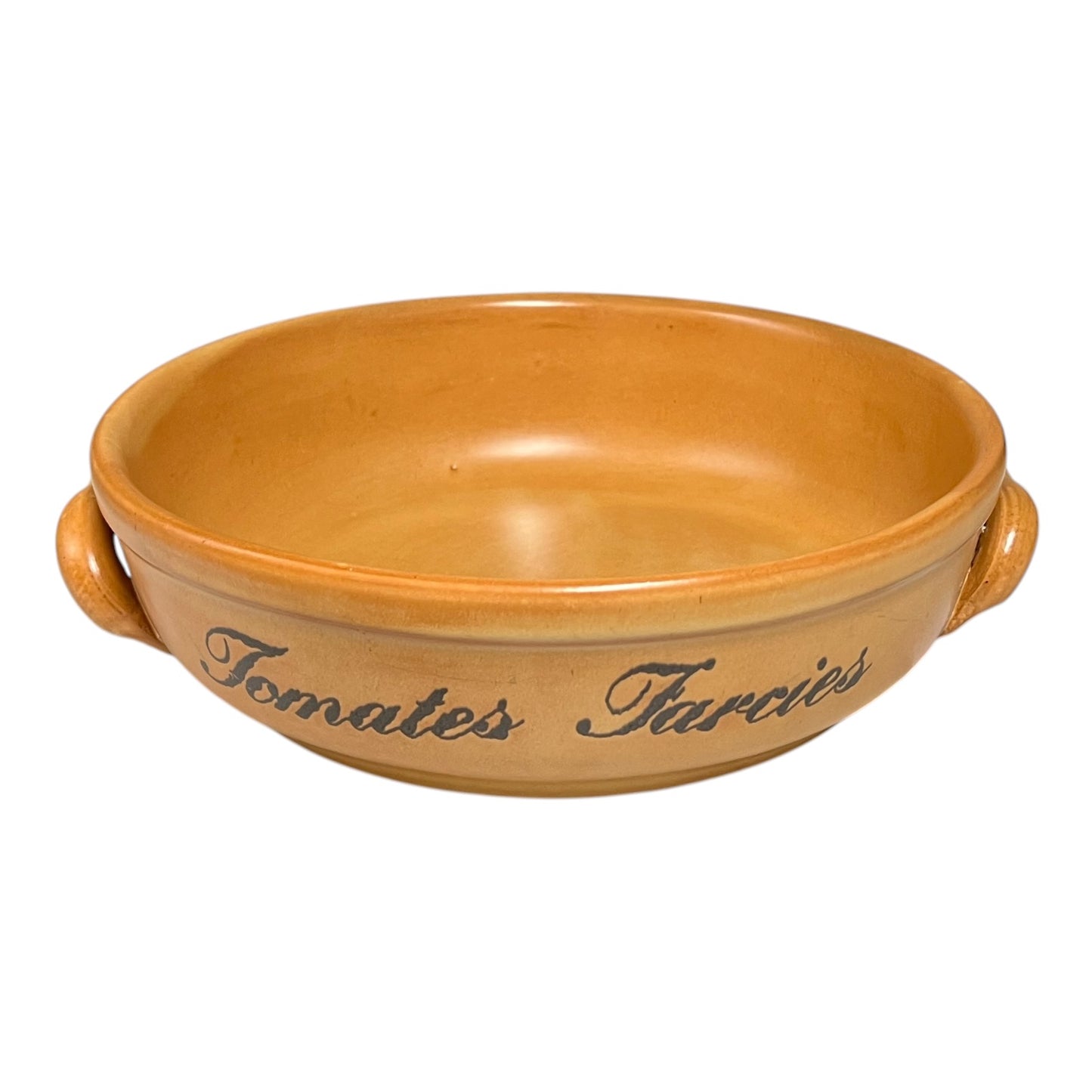 Ceramic baking dish with handles and engraved text on a white background