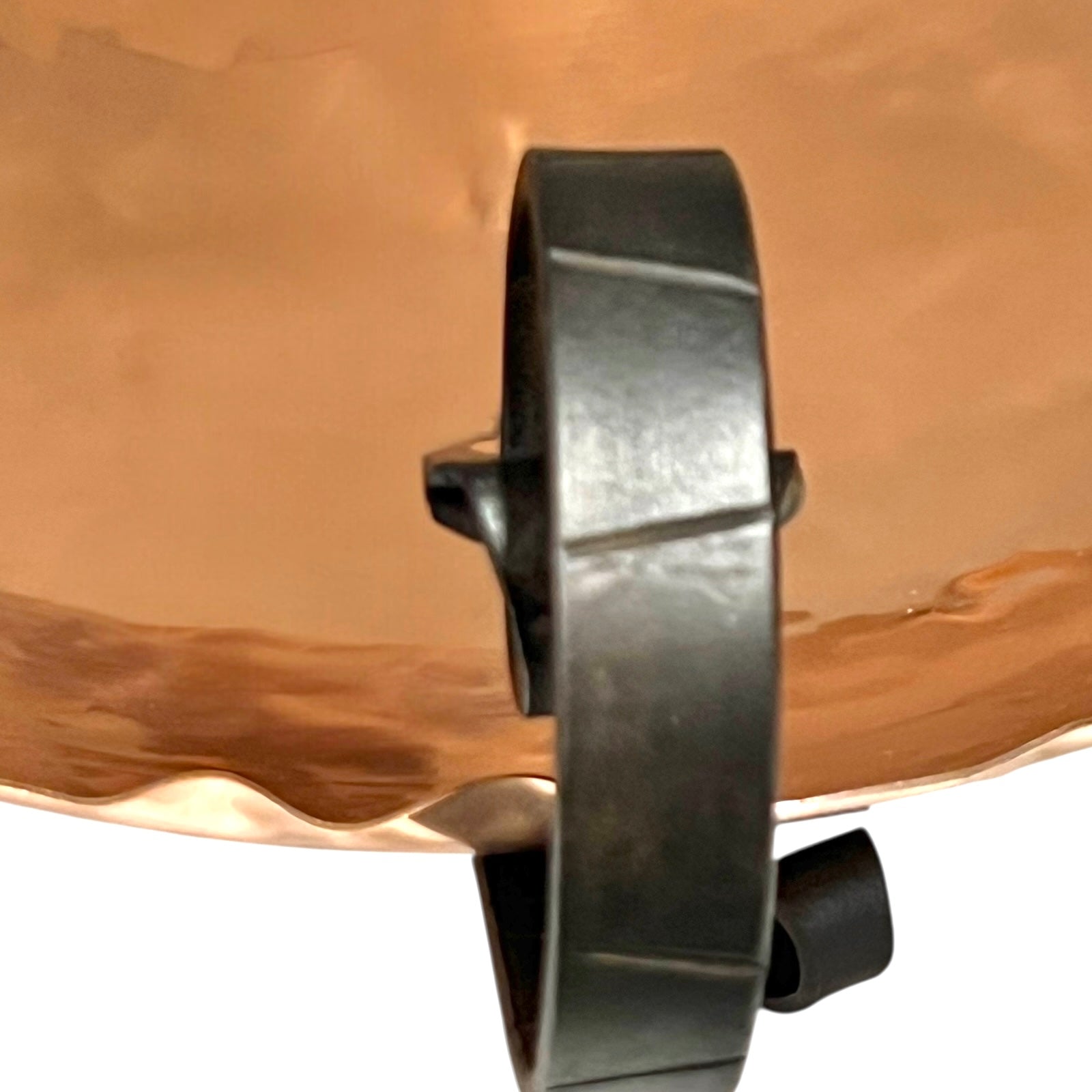 Close-up of a copper fruit bowl on a white background
