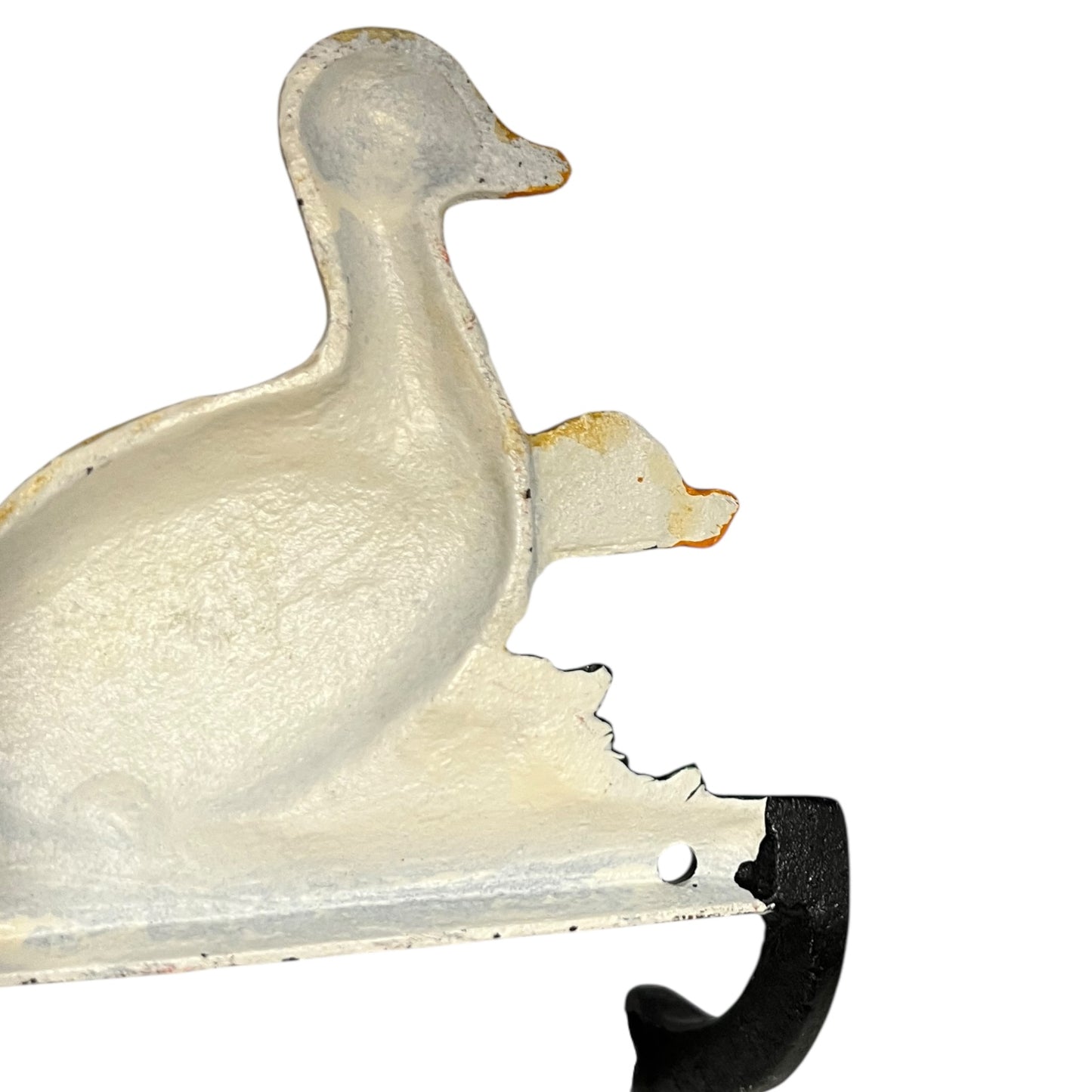 Close up of French farmhouse style goose cast iron toilet roll holder on a white background